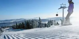 Snowboarder going down mountain