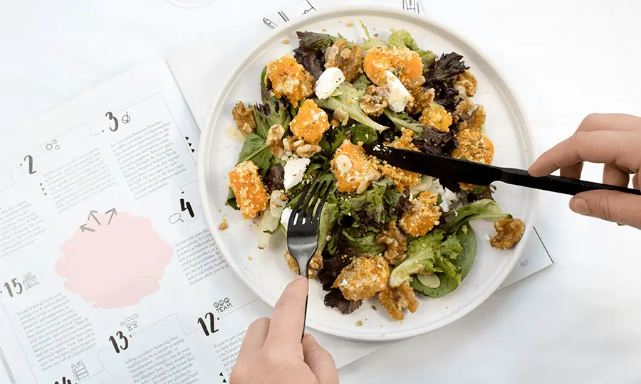 Image of a healthy pumpkin and mixed lettuce salad