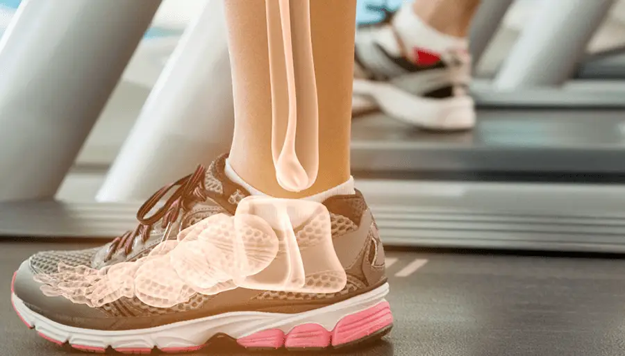 Close up image of someone ankle standing on a treadmill showing a xray like vision of their bones