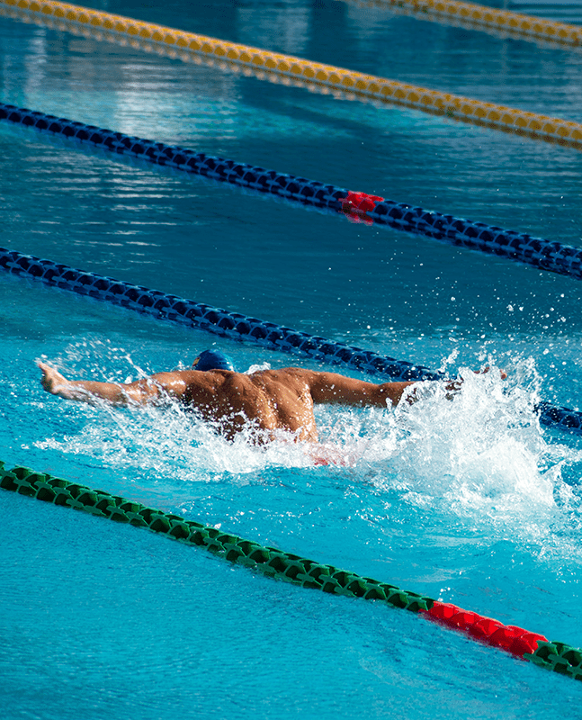 Photograph of a professional swimmer performing the butterfly stroke