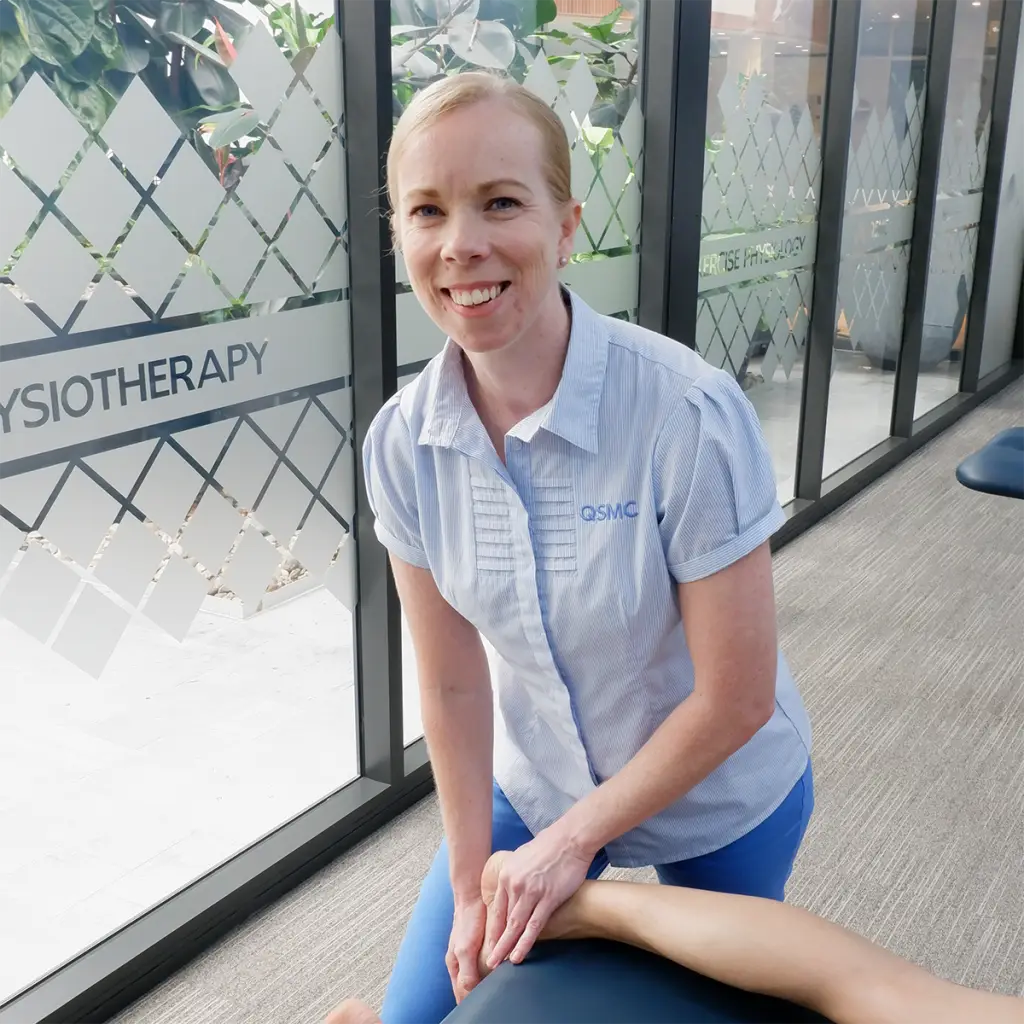 Headshot of Dr Melanie Fuller treating a ballet dancer's ankle