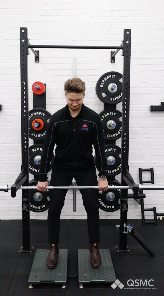 QSMC Exercise Physiologist, Toby Edmanson is displaying the measurement technique of Isometric Mid-Thigh Pull Test (IMPT) on the ForceDecks performance measurement tool.