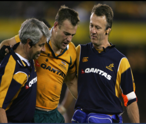 QSMC Physiotherapist David Bick on field at Wallabies Rugby game